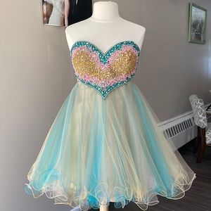 Homecoming dress size 12. Top is beaded. Bottom is layered tulle. Never altered